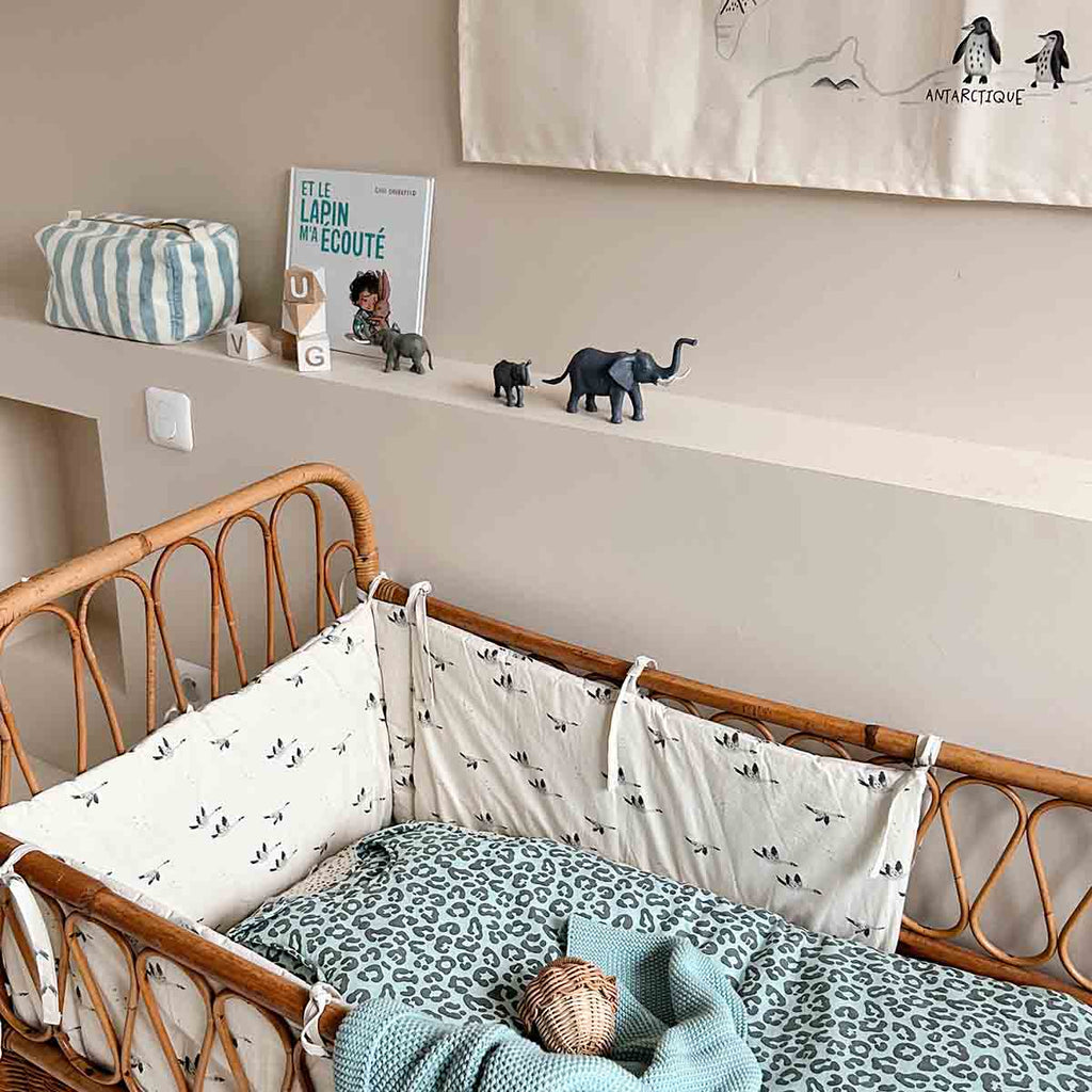 Rose in April Charly Goose Bed Bumper in bedding, showing soft fabric with plush goose pattern and cushioned edges for baby comfort.