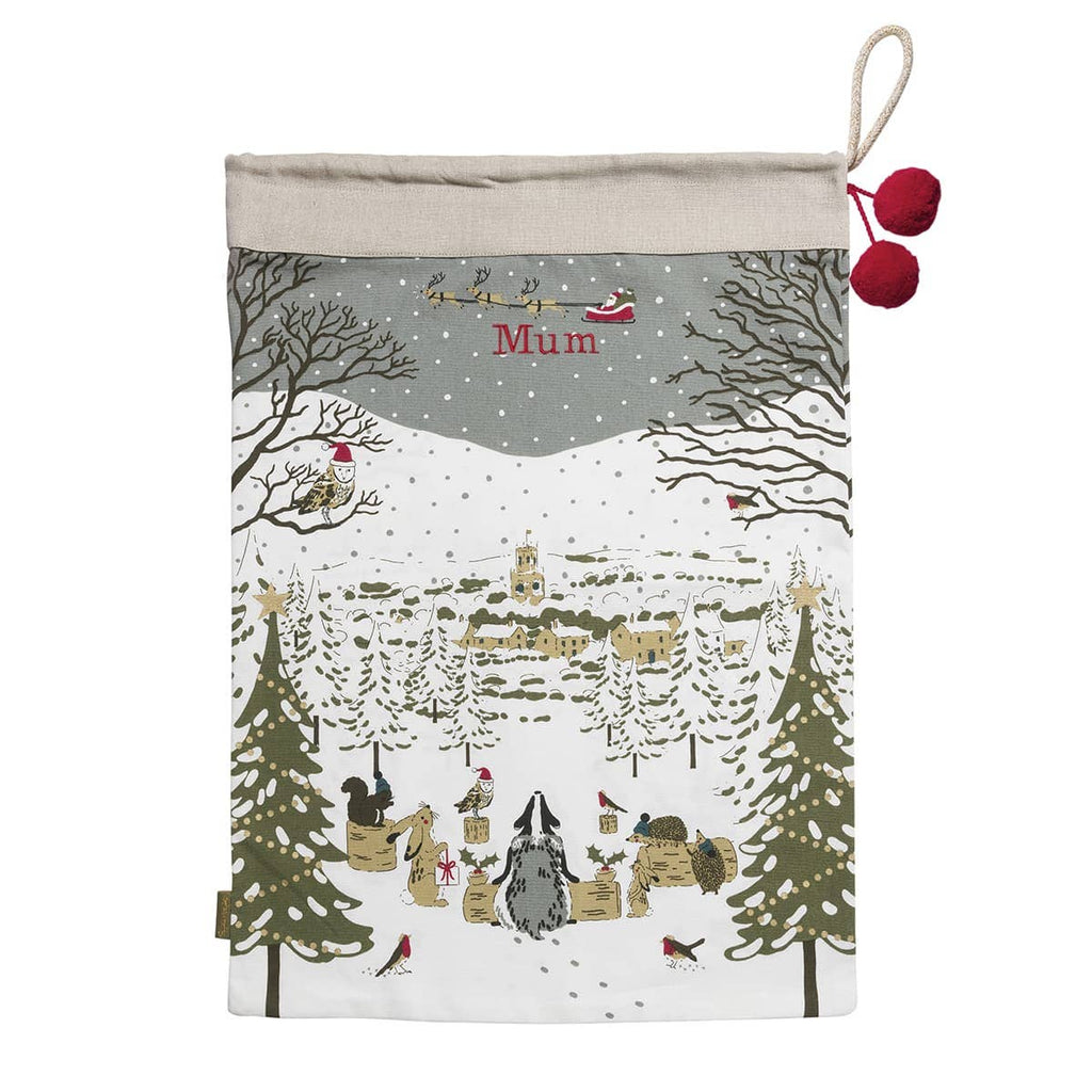 Christmas-themed stocking with a snowy village design and 'Mum' text.