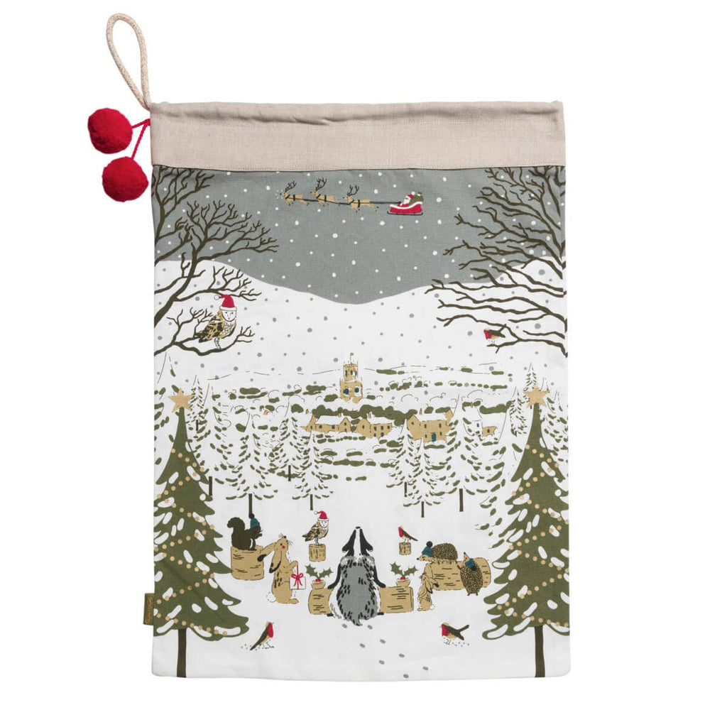 Decorative Christmas pouch with festive design of Santa Claus and reindeer in a snowy village.