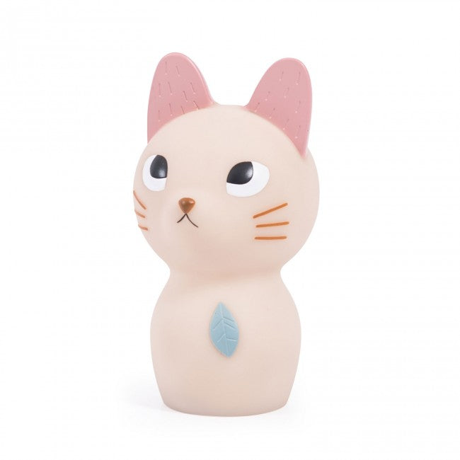 Cream cat-shaped night light with pink ears, brown whiskers and a blue leaf detail on its chest, shown against a white background.