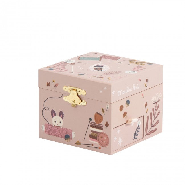 Closed After the Rain musical jewellery box with pink illustrated designs, gold clasp and cat sewing-themed artwork on a white background