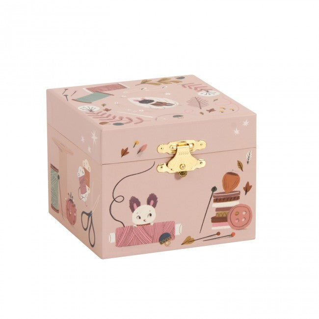 Closed After the Rain musical jewellery box with pink illustrated designs, gold clasp and cat sewing-themed artwork on a white background
