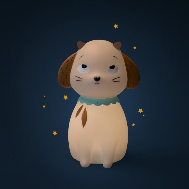 Sheep-shaped night light glowing warmly against a dark navy background with small yellow stars.