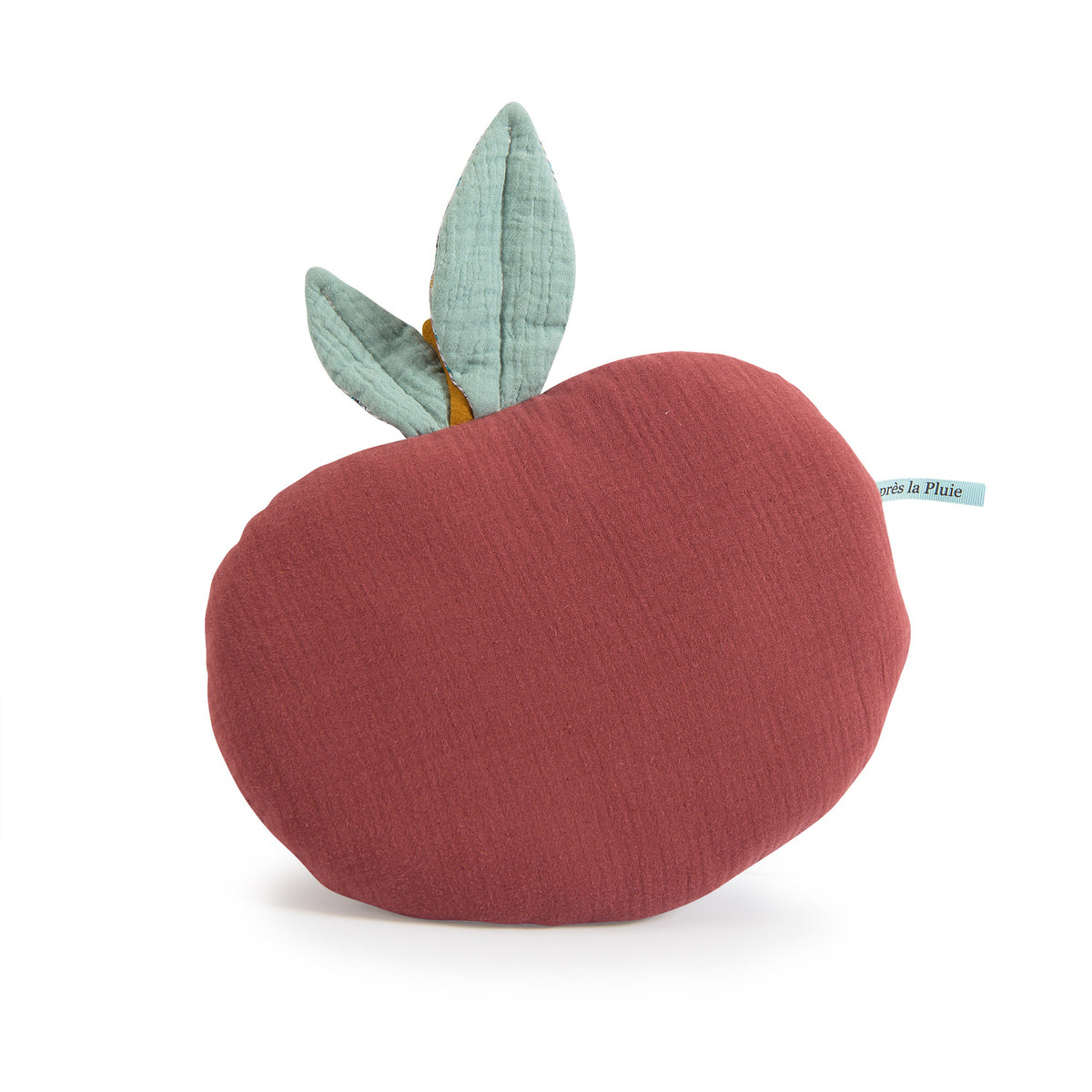 Plum red apple-shaped cushion with two turquoise floral-patterned leaves on a white background