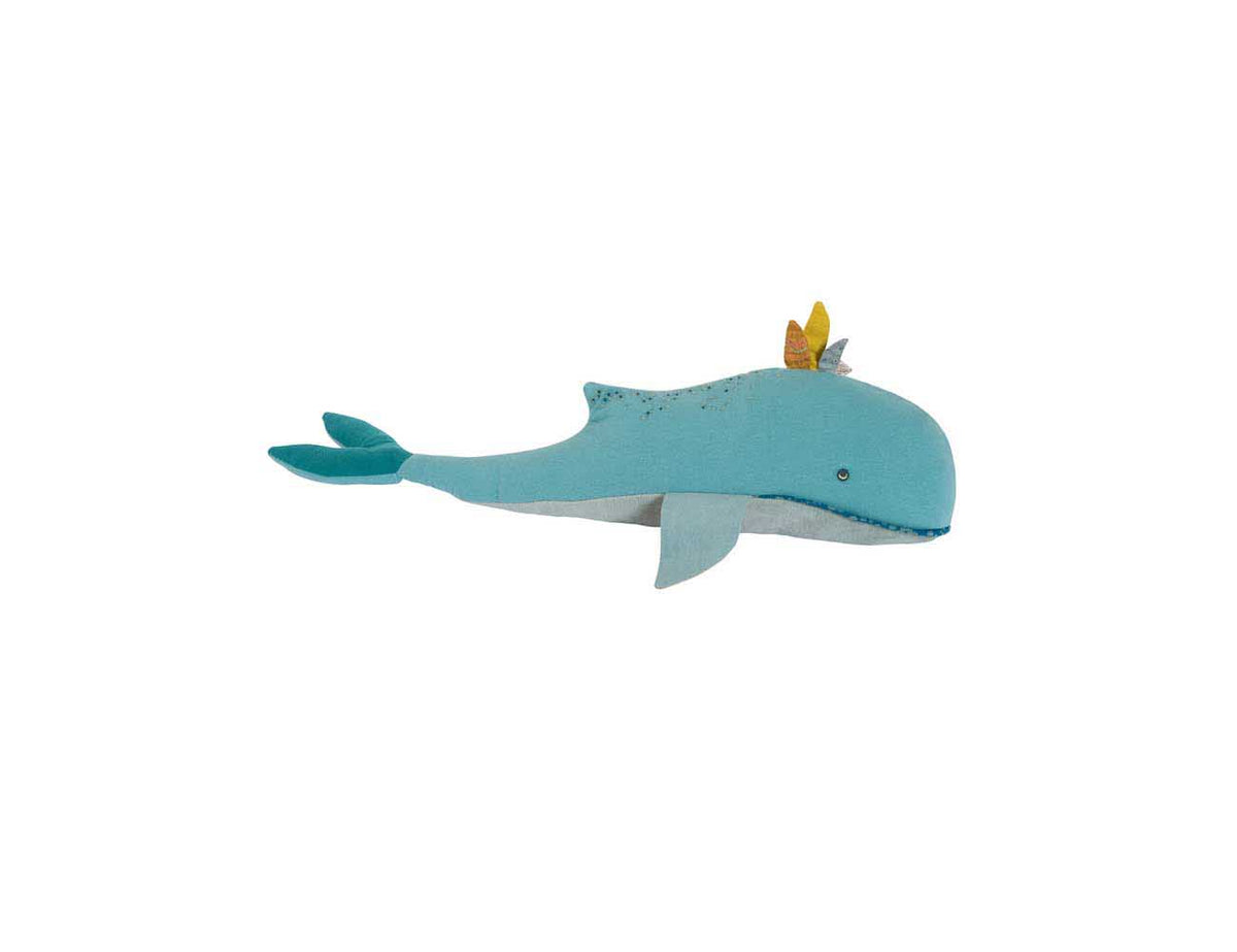 Blue whale cushion with embroidered details and small yellow fins on a white background