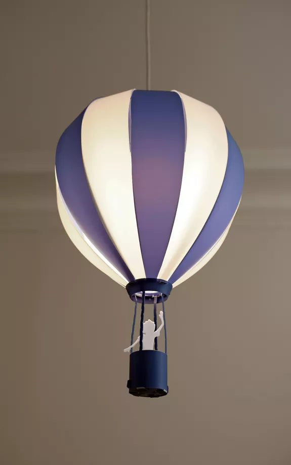 Blue and white striped hot air balloon pendant light glowing in a room
