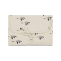 Folded Charly Goose changing mat in cream with a grey goose print and a matching fabric tie closure.