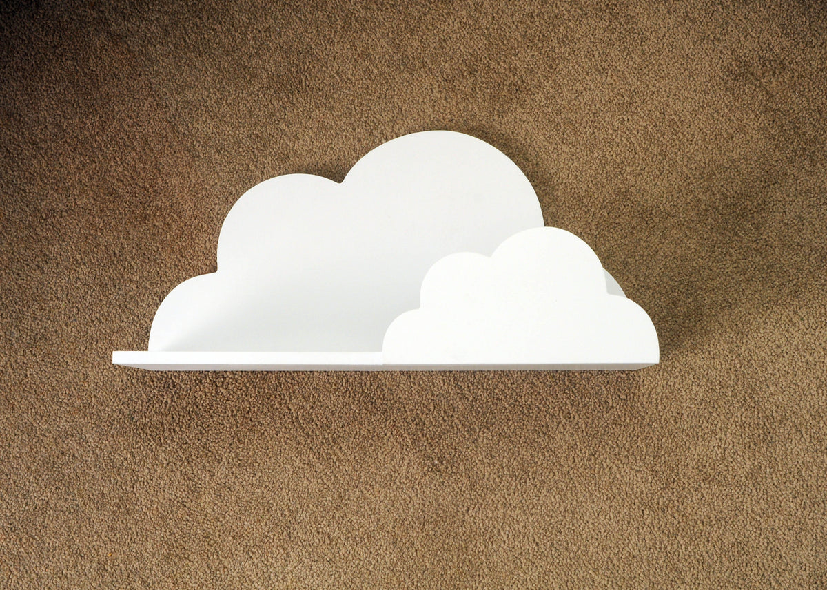 White cloud-shaped wall shelf mounted on a textured beige wall