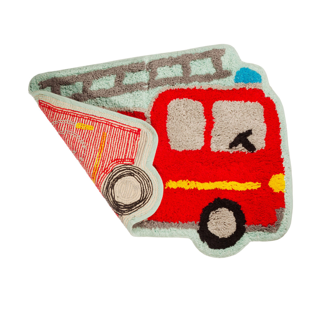 Red fire engine-shaped rug shown folded back to reveal its red and cream striped backing, with a pale green border and grey wheel detail.