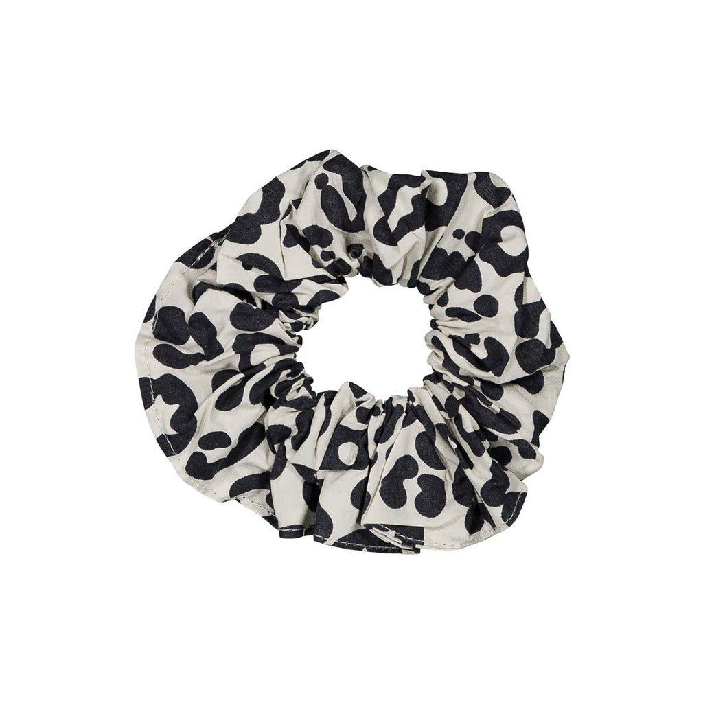 Graou Greige scrunchie featuring a bold black leopard print on a light greige cotton fabric, displayed against a white background.