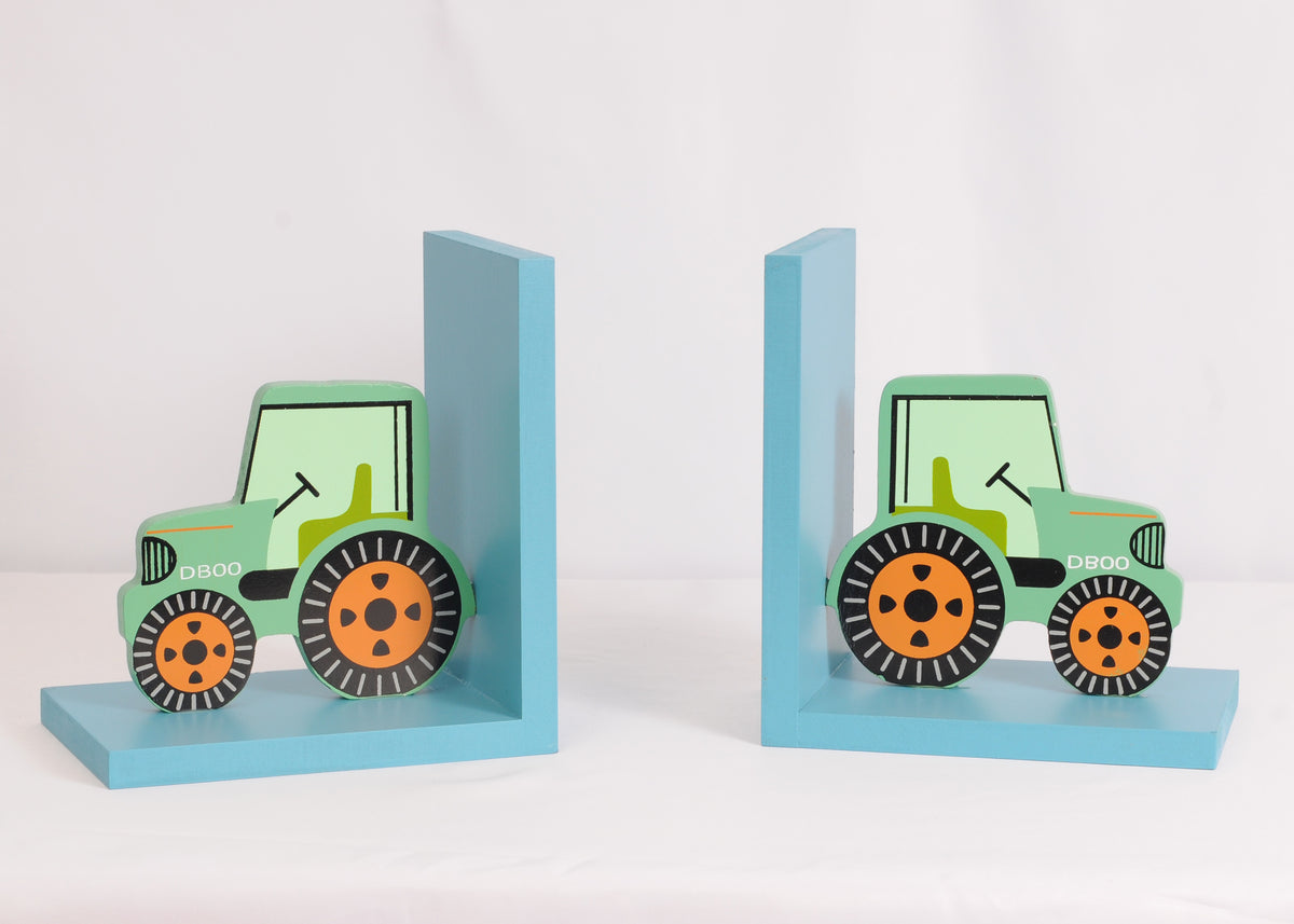 Pair of green tractor-shaped bookends with blue bases displayed on a white surface