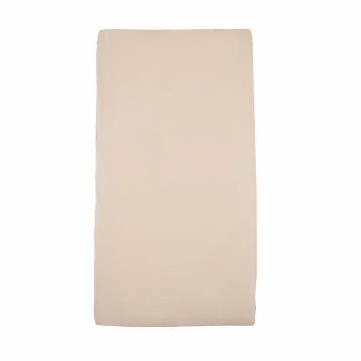 Plain latte-coloured fitted cot sheet displayed against a white background, featuring a smooth neutral beige finish.