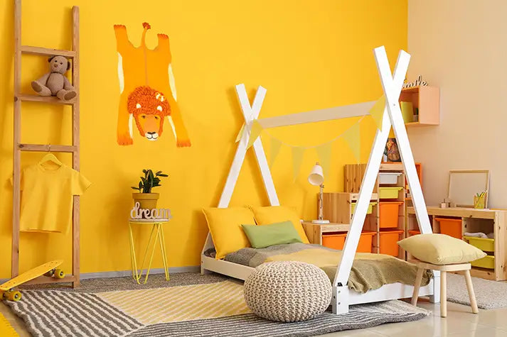 Leopold the Lion felt rug in a colourful children’s bedroom