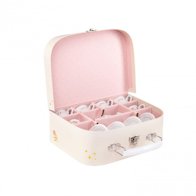 Open cream tea set case with a pink interior, displaying miniature porcelain cups, saucers and tea accessories in individual compartments.