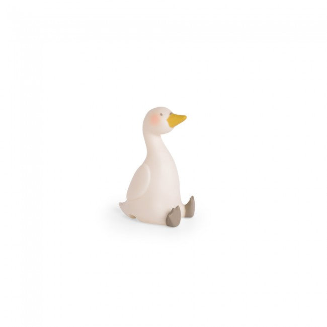 Moulin Roty The Little Dance School swan night light with a cream-white body, yellow beak, rosy cheeks and grey feet, shown on a white background.