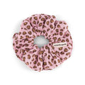 Mini Leopard Candy Pink scrunchie made from pink cotton muslin with a brown leopard print and a small Rose in April label, displayed against a white background.