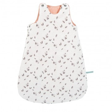 Moulin Roty Après la Pluie cream baby sleeping bag with a delicate falling-leaves print, peach-coloured lining and shoulder press-stud fastenings.