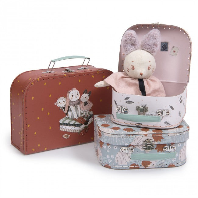 Set of three Moulin Roty Après la Pluie decorative storage cases in plum, pink and blue designs, with a rabbit doll displayed inside one case