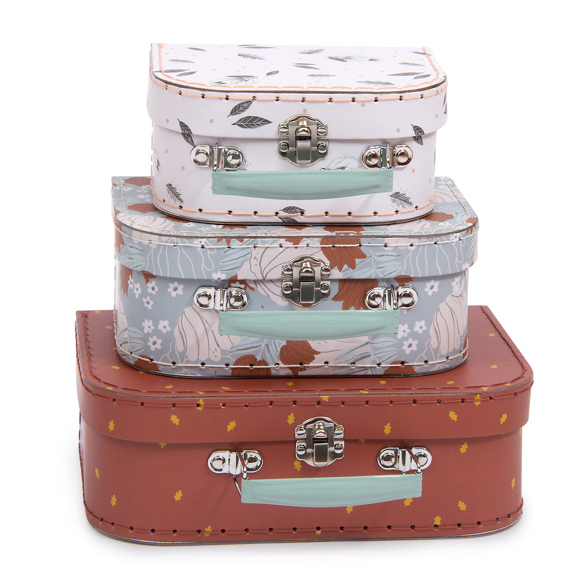 Three Moulin Roty Après la Pluie decorative storage cases stacked together in white, blue and plum designs on a white background
