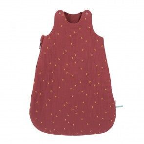 Moulin Roty Après la Pluie terracotta baby sleeping bag with a subtle oak leaf print, rounded shape and shoulder press-stud fastenings.