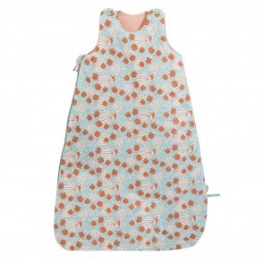 Moulin Roty Après la Pluie baby sleeping bag with a blue-grey woodland foraging print, featuring rust-orange mushrooms and leaves, peach-coloured lining and shoulder fastenings.