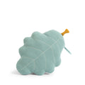 Turquoise oak leaf-shaped cushion with stitched leaf details and an ochre stem on a white background