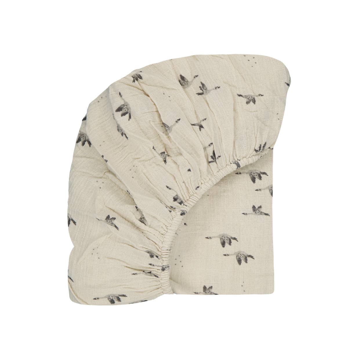 Olivia Goose Natural fitted cot sheet in cream with a grey flying goose print and elasticated edges.