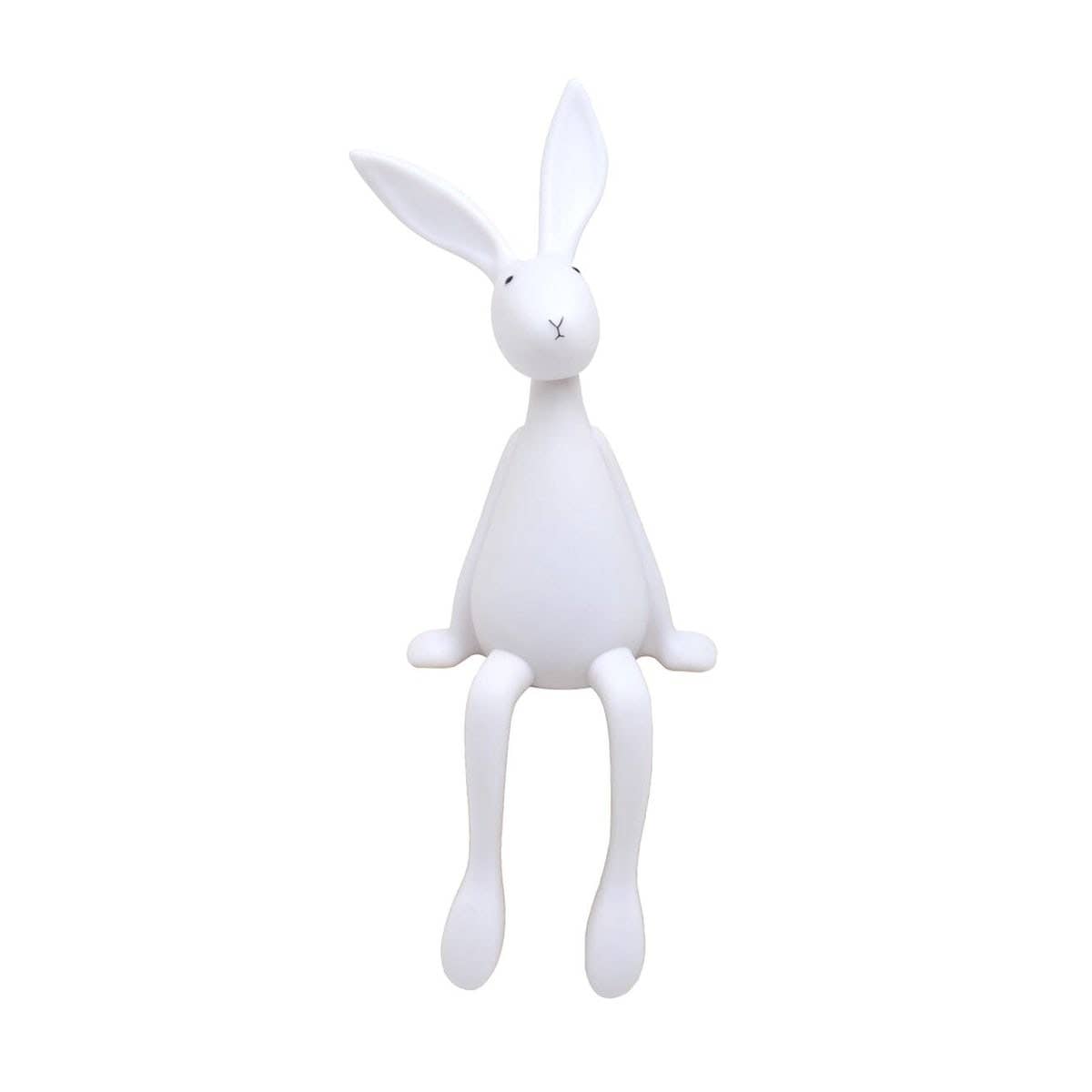 White Joseph Bunny night light with long upright ears, a simple face and dangling legs, shown against a plain white background.