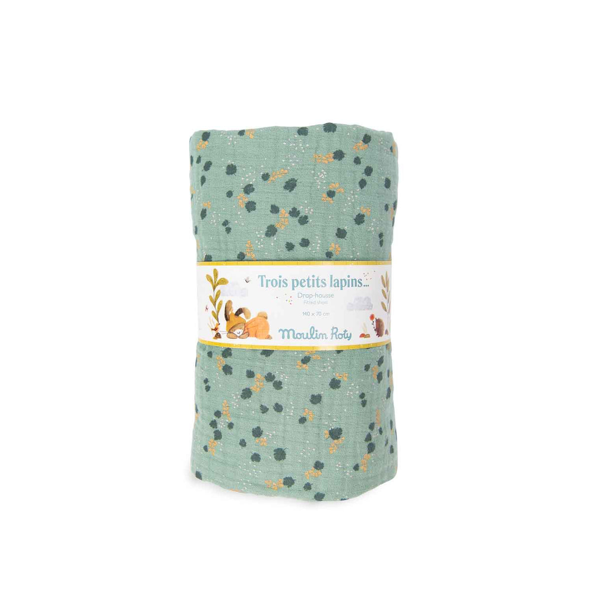 Sage green fitted cot sheet with a delicate botanical pattern in Moulin Roty Three Little Rabbits packaging on a white background