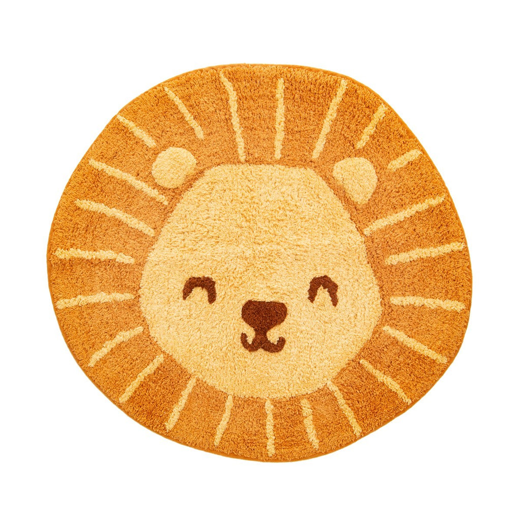 Sass & Belle lion-shaped rug in orange and sandy yellow, featuring a smiling lion face with a darker brown nose and cream sunburst details around the mane.