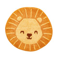 Sass & Belle lion-shaped rug in orange and sandy yellow, featuring a smiling lion face with a darker brown nose and cream sunburst details around the mane.