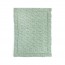 Close-up of the plain sage green reverse side of the baby quilt on a white background