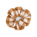Vichy Caramel scrunchie featuring a warm caramel and cream gingham check pattern, made from cotton muslin and displayed against a white background.