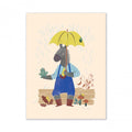 Moulin Roty Woody Apple 30 × 40 cm poster featuring Anatole the Donkey in blue dungarees and red wellies, holding a yellow umbrella beside his frog friend in the rain.