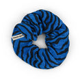 Zebrou Greek Blue scrunchie featuring a bold black zebra-inspired pattern on vibrant blue cotton muslin, displayed against a white background.